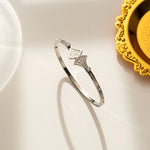 18K silver Art Deco fan bangle with pearl and crystals by Biya Accessoires.