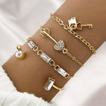 Waterproof 18K gold romantic charm bangle stack Biya Accessoires UAE.