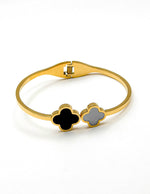 Gold bracelet with clover-shaped ends on a white background gift for her