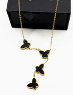 18K gold plated black butterfly lariat necklace by Biya Accessoires.
