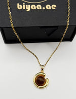 18K gold plated crescent moon pendant with golden cat's eye stone.