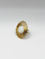 18K gold plated oversized sunburst pearl statement ring by Biya Accessoires.