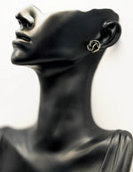 Close-up of premium hypoallergenic imitation jewelry featuring a black flower design.