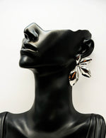 Biya Accessoires artificial jewellery online dubai molten silver leaf statement studs.