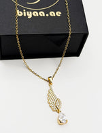 Waterproof non-tarnish artificial gold jewelry resting in a luxury presentation box.