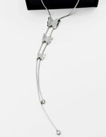Waterproof non-tarnish silver butterfly Y-necklace resting in a luxury gift box.
