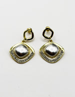 Best imitation jewellery brands in uae gold diamond-shaped earrings with floating pearls and crystals.