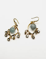 Biya Accessoires artificial jewellery online dubai gold swirl dangle earrings with opalescent bead.