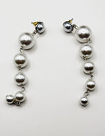 Best imitation jewellery brands in uae shoulder grazing pearl earrings.