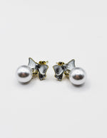 Biya Accessoires artificial jewellery online dubai pearlescent bow and pearl drop earrings.