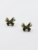 Best fashion jewelry in UAE white iridescent bow earrings for women.