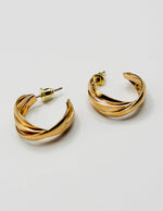 Biya Accessoires gold multi strand twisted hoop earrings.