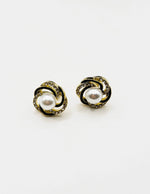 Best fashion jewelry in UAE ivory black and gold swirl pearl earrings for women.