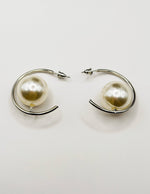 Everyday luxury fashion jewelry gold tone floating pearl studs by Biya Accessoires Dubai.
