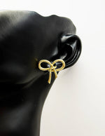 Close-up of premium hypoallergenic imitation jewelry featuring a rope bow design.
