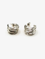 Biya Accessoires layered chunky silver hoop earrings.