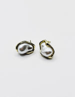 Biya Accessoires organic molten gold stud earrings with baroque pearl.