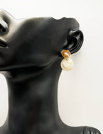 Close-up of premium hypoallergenic imitation jewelry featuring a marbled stone design.