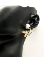 Close-up of premium hypoallergenic imitation jewelry featuring a pearl and butterfly design.
