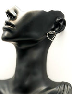 Close-up of premium hypoallergenic imitation jewelry featuring a silver heart design.