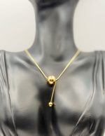 Biya Accessoires 18K gold plated minimalist sphere lariat necklace with snake chain.