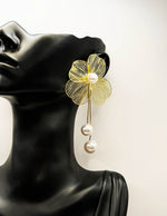 Best imitation jewellery brands in uae gold petal earrings with pearl drips.