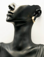 Biya Accessoires gold twisted triple-hoop statement earrings.