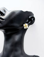 Close-up of premium hypoallergenic imitation jewelry featuring a gold textured cross.