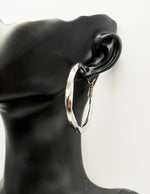 Everyday luxury fashion jewelry high polish hoops by Biya Accessoires Dubai.