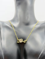 Everyday luxury fashion jewelry Love script necklace with durable PVD gold coating in Dubai.