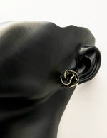 Everyday luxury fashion jewelry gold tone botanical studs by Biya Accessoires Dubai.