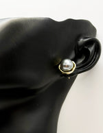 Close-up of premium hypoallergenic imitation jewelry featuring a mirror finish center.