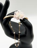 Hypoallergenic gold plated open bracelet with draped pearl chain United Arab Emirates.