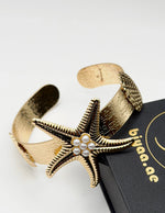 Waterproof 18K gold starfish and pearl statement cuff Biya Accessoires UAE.