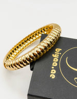 Non-tarnish fluted gold statement cuff for women Dubai luxury fashion.