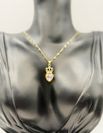 Hypoallergenic gold tiara and heart necklace with clear gemstone.