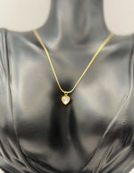 Waterproof small minimalist gold heart necklace on silk.