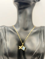 Waterproof gold and black floral necklace for women on silk background.
