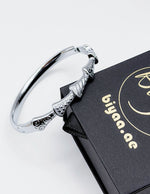 Premium silver fan-link architectural bangle by Biya Accessoires.