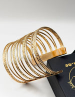 Hypoallergenic gold plated smooth and textured bangle set United Arab Emirates.