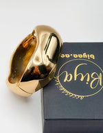 Non-tarnish thick gold statement bangle for women Dubai luxury fashion.