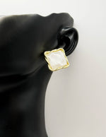 Close-up of premium hypoallergenic imitation jewelry featuring a textured gold design.