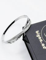 Silver bracelet on a black box with 'biyaa.ae' branding