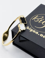 Waterproof gold onyx and mother of pearl quatrefoil bracelet for women Dubai.