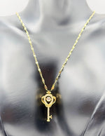 Modern luxury gold crown key statement necklace UAE.
