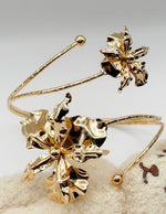 Non-tarnish 3D floral wrap armlet for women Dubai luxury fashion.