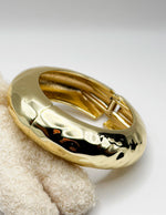 Non-tarnish thick textured gold statement bangle for women Dubai luxury fashion.