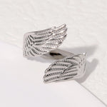 Modern luxury fine art editorial silver jewelry wrap wing ring gift for her.
