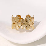 Modern luxury fine art editorial gold jewelry floral wrap ring gift for her.