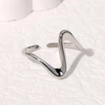 Modern luxury fine art editorial silver jewelry linear wave ring gift for her.